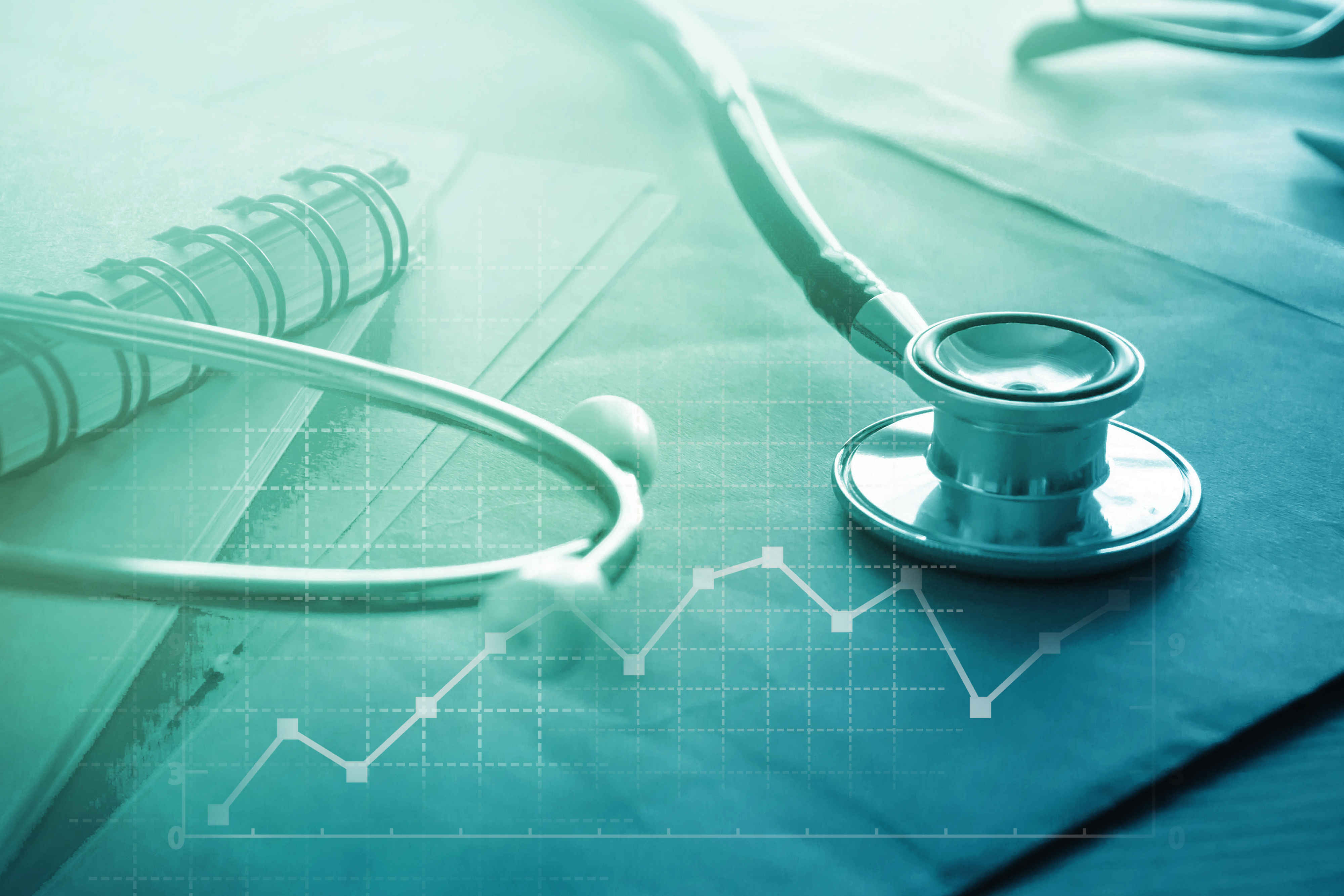 A stethoscope on a file folder with a line graph superimposed over the image.