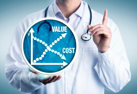Doctor in white coat holding a digital illustration of value/cost graph. 
